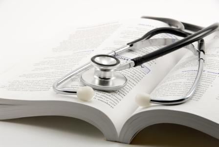 Stethoscope resting on a book